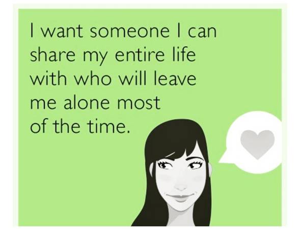 A green ecard-style graphic with a drawing of a dark-haired woman with bangs and a slight smirk, looking sideways, beside a speech bubble holding a gray heart. Text reads: "I want someone I can share my entire life with who will leave me alone most of the time."