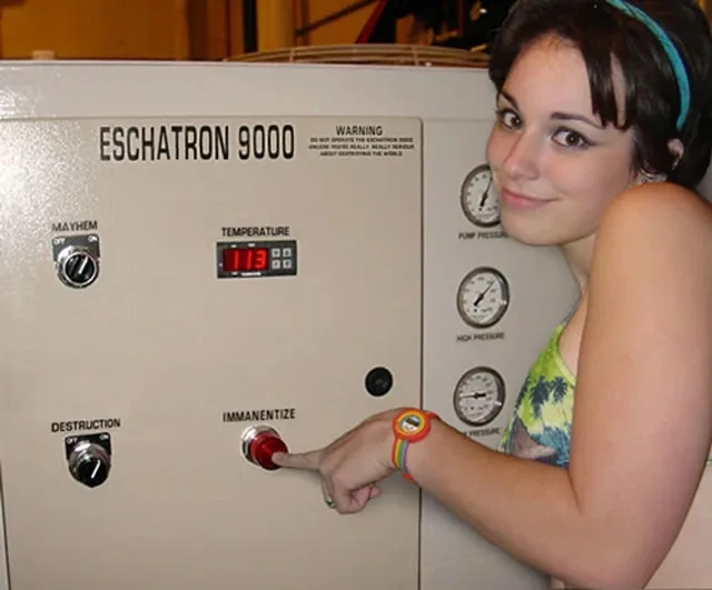 A smiling young woman with short dark bangs and a teal headband glances at the camera while pointing at a big red button on a beige industrial control panel. She wears a rainbow wristwatch. The panel reads: "ESCHATRON 9000". Warning: "DO NOT OPERATE THE ESCHATRON 9000 UNLESS YOU'RE REALLY, REALLY SERIOUS ABOUT DESTROYING THE WORLD". Labels: "MAYHEM", "TEMPERATURE" with a display reading 113, "DESTRUCTION",…