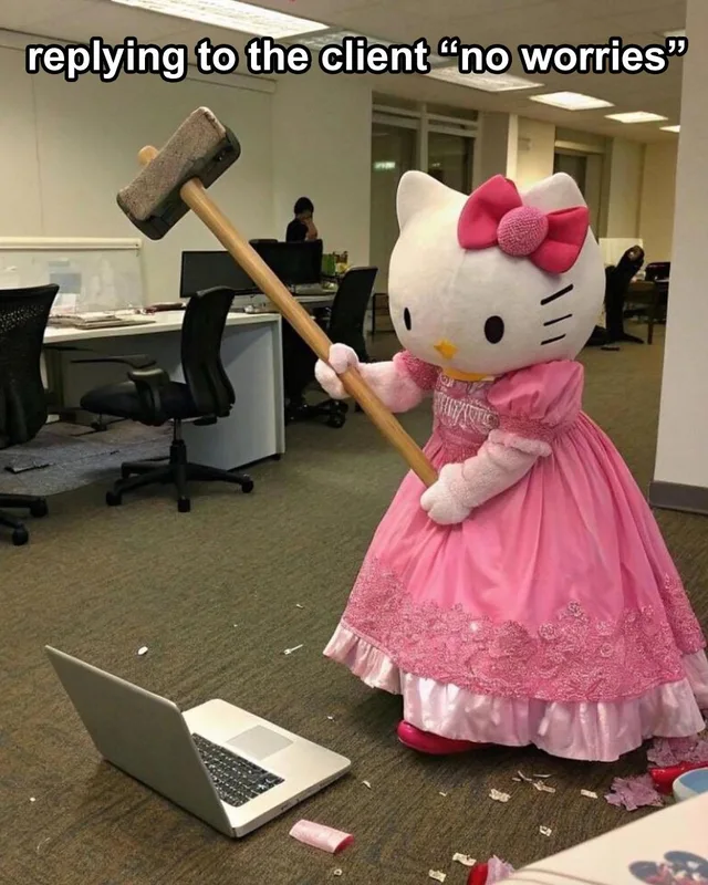 A person in a Hello Kitty mascot costume with a pink bow and a ruffled pink princess gown swings a large sledgehammer at an open silver laptop on the carpet of an office. Debris litters the floor. Caption at top: "replying to the client "no worries""