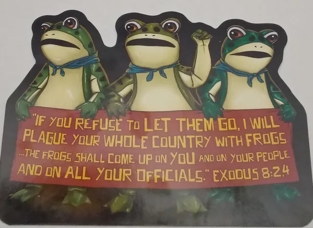 Three cartoon frogs in blue bandanas stand behind a red banner, one raising a fist. Banner text: "IF YOU REFUSE TO LET THEM GO, I WILL PLAGUE YOUR WHOLE COUNTRY WITH FROGS. ...THE FROGS SHALL COME UP ON YOU AND ON YOUR PEOPLE AND ON ALL YOUR OFFICIALS." EXODUS 8:2,4