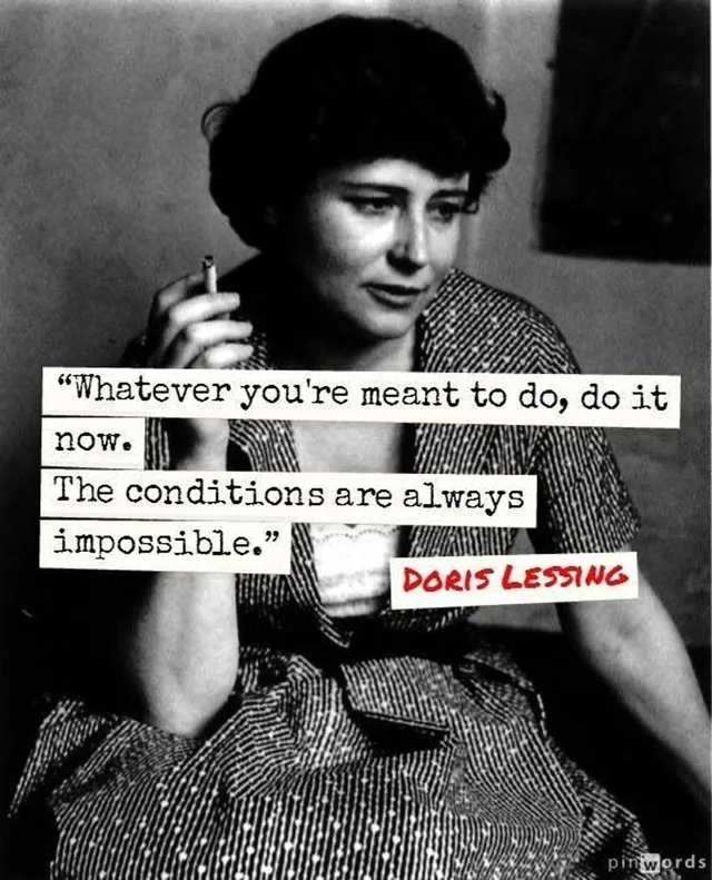 Black-and-white photo of a woman with short dark hair holding a cigarette, looking down. Typewriter text on paper strips reads: "Whatever you're meant to do, do it now. The conditions are always impossible." Red text: "Doris Lessing". Watermark: pinwords.