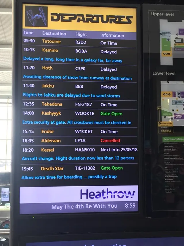 Photo of a Heathrow airport departures screen with a TIE fighter logo and Star Wars-style "DEPARTURES" title. Columns: Time, Destination, Flight, Information. 09:30 Tatooine R2D2 On Time. 10:15 Kamino BOBA Delayed: Delayed a long, long time in a galaxy far, far away. 11:20 Hoth C3P0 Delayed: Awaiting clearance of snow from runway at destination. 11:40 Jakku BB8 Delayed: Flights to Jakku are delayed due to sand…