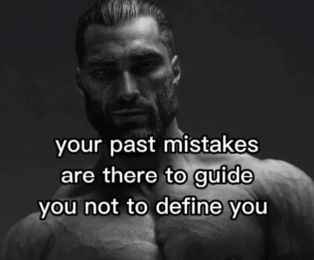 A dark, black-and-white photo of a muscular, bearded man with slicked-back hair and a stern, intense expression, shirtless and lit from above. White text with a black outline reads: "your past mistakes are there to guide you not to define you".