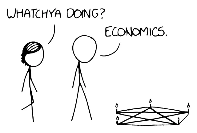 Black and white stick figure comic. A figure with scribbled dark hair asks, "WHATCHYA DOING?" A bald stick figure replies, "ECONOMICS." On the floor beside them is a pentagram drawn in a ring with a lit candle at each point.